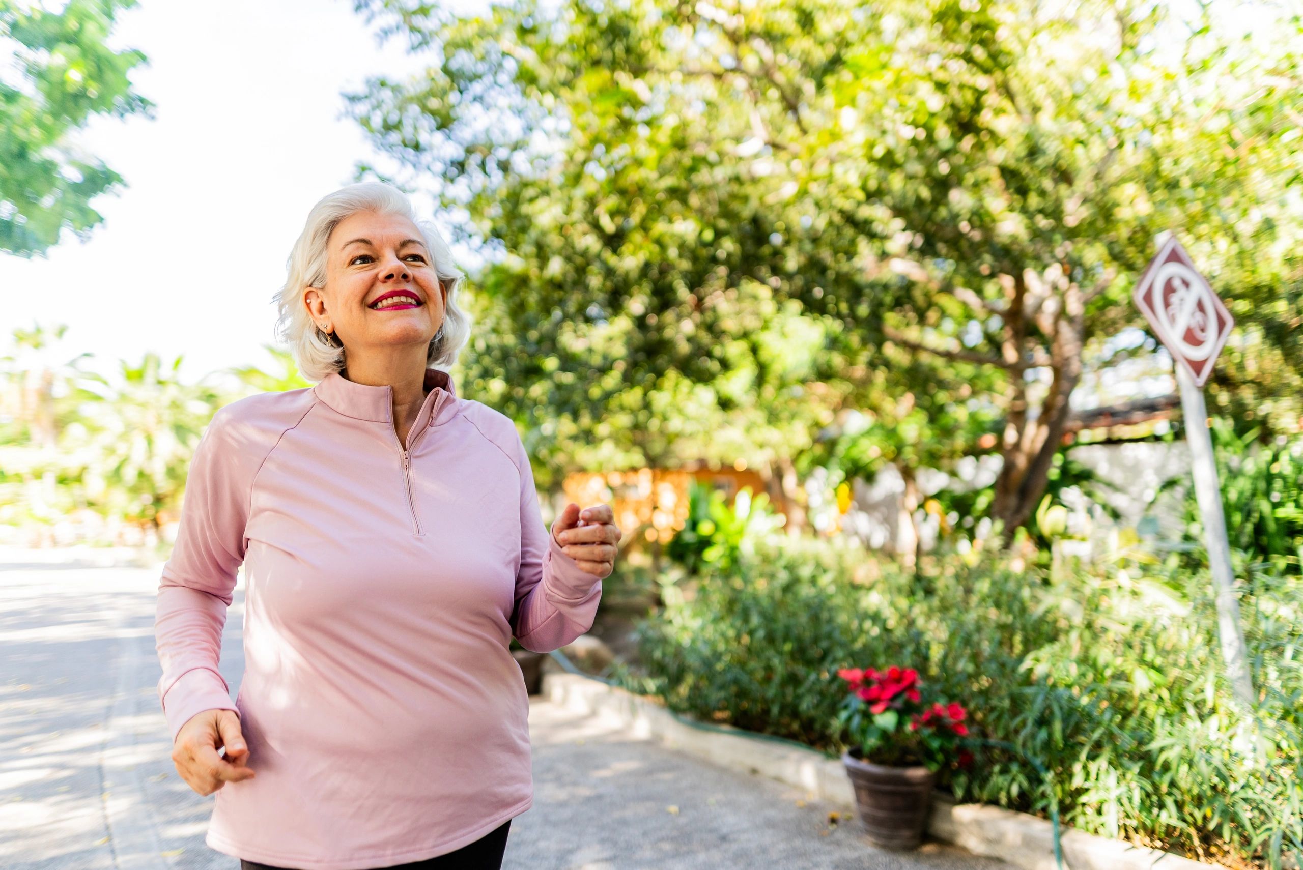 Woman running outdoors as a symbol of healthy aging and vitality